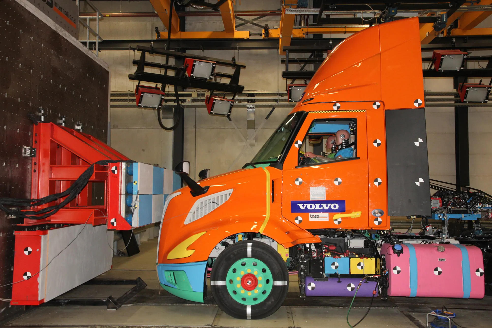Orange Volvo truck during a safety test